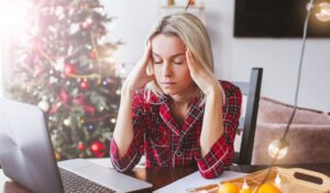 Woman feeling holiday overwhelm needing nervous system regulation, Simone Fortier brain-based coaching.